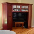F03. Custom-built corner media cabinet. 77"h 